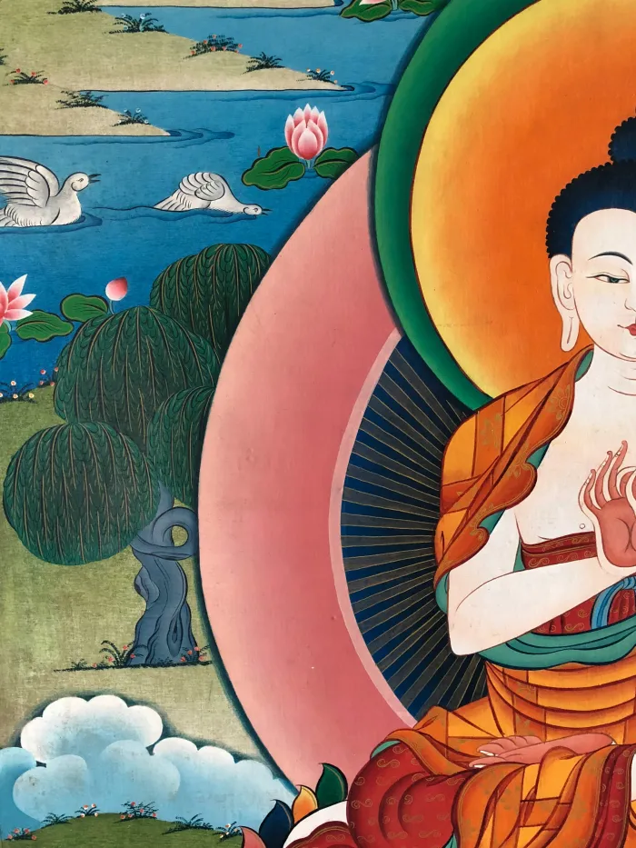 Traditional Tibetan Thangka painting showing a close-up of Lord Buddha with a colorful halo, serene landscape, and lotuses. | PrintPosters.in