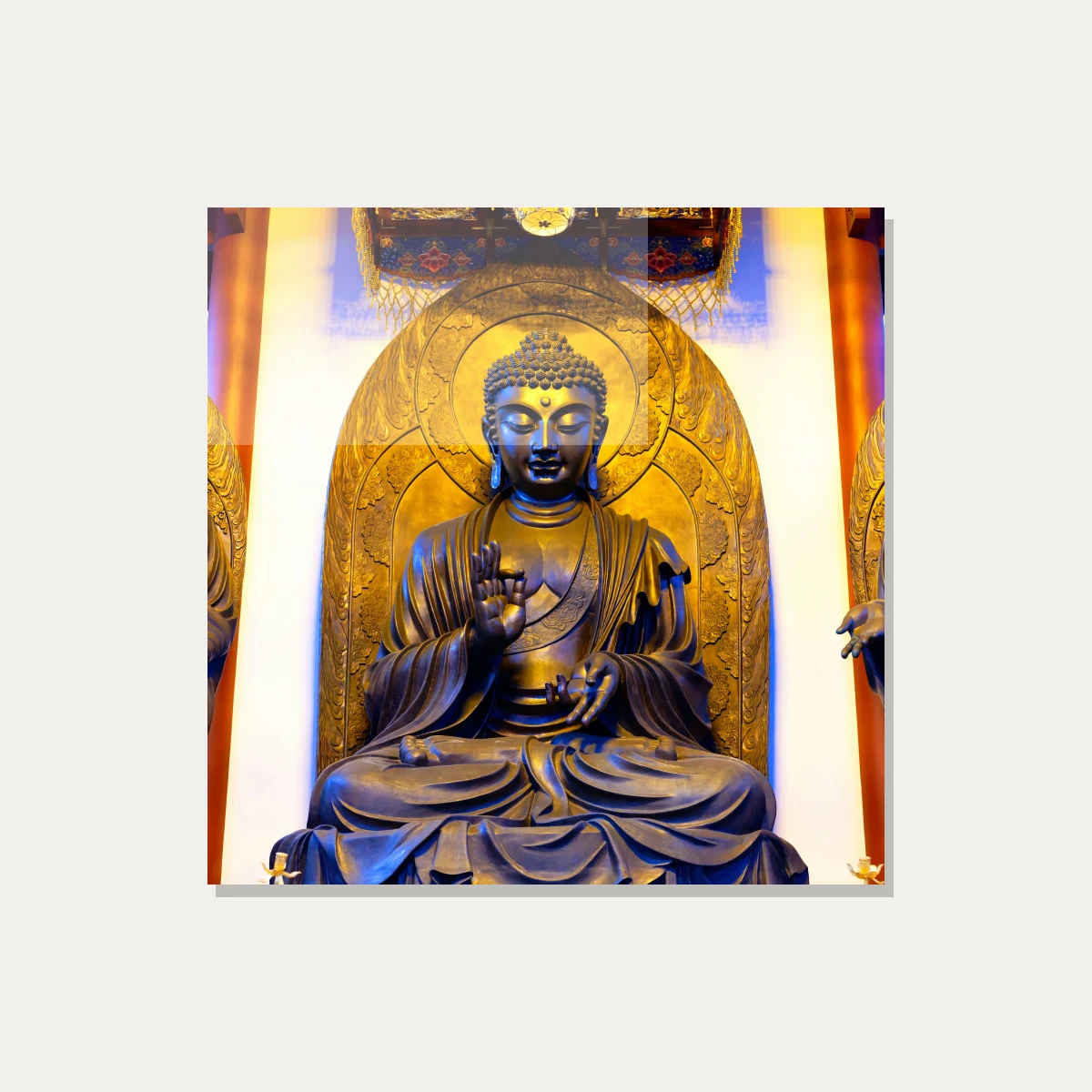 A majestic golden bronze statue of Gautama Buddha seated in meditation inside a temple shrine with warm overhead lighting. — acrylic preview | PrintPosters.in
