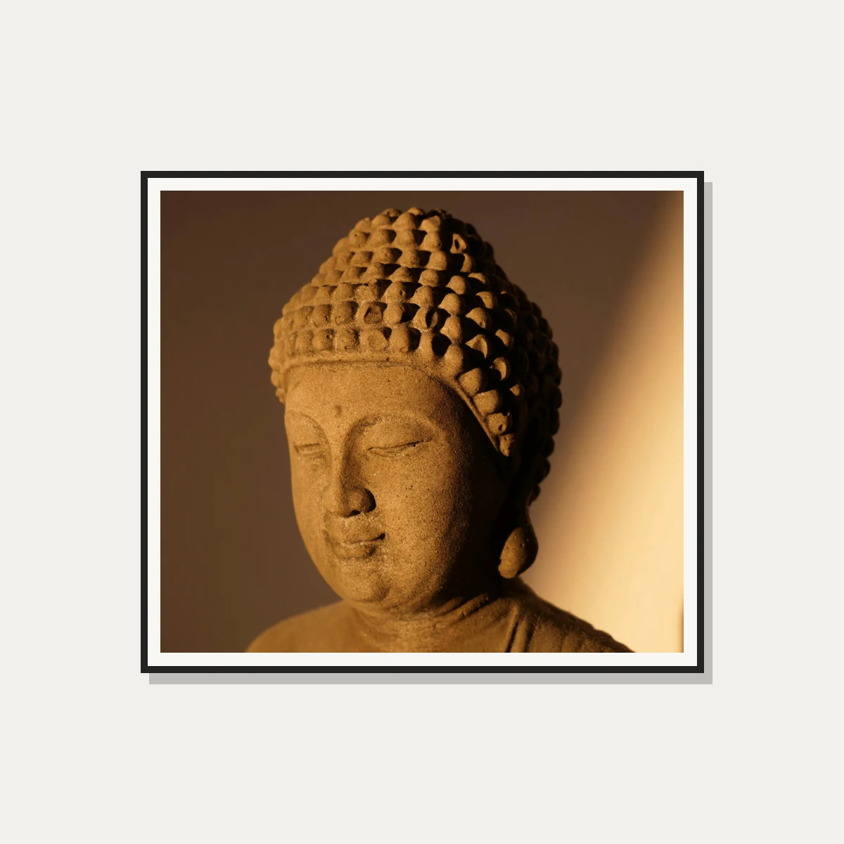 Warm Lit Stone Buddha Head Canvas — photo frame preview | PrintPosters.in