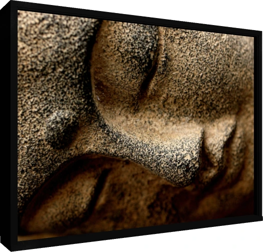 Extreme close-up of a textured stone sculpture of Lord Buddha's serene face, showing his closed eye and nose. — floater frame preview | PrintPosters.in