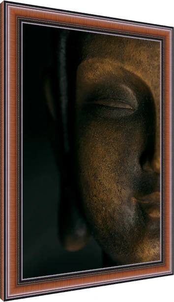 A close-up photograph of a dark bronze Lord Buddha face statue, illuminated from one side with deep shadows. — photo frame preview | PrintPosters.in