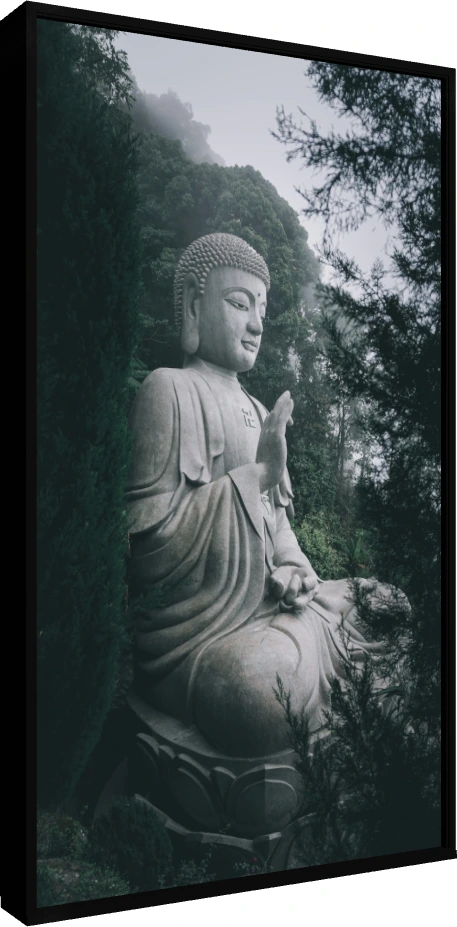 A large stone statue of Lord Buddha meditating amidst a misty green forest, featuring a sacred swastika on his chest. — floater frame preview | PrintPosters.in