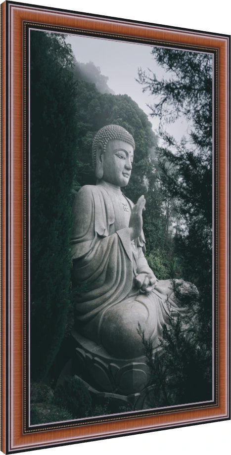 A large stone statue of Lord Buddha meditating amidst a misty green forest, featuring a sacred swastika on his chest. — photo frame preview | PrintPosters.in