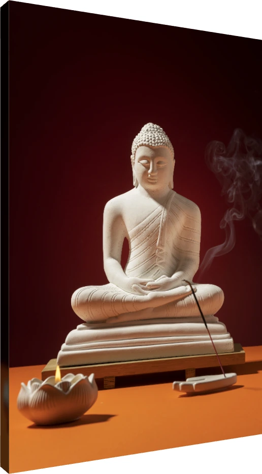 A white Lord Buddha statue in meditation pose with burning incense and a lit lotus candle against a red background. | PrintPosters.in
