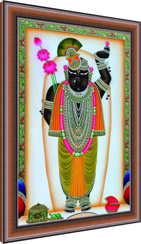 A traditional Pichwai painting of Lord Shrinathji adorned with elaborate jewelry and holding lotus flowers. — photo frame preview | PrintPosters.in