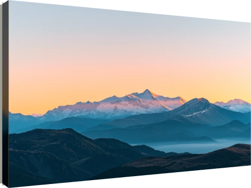 Panoramic view of majestic snow-capped mountain peaks illuminated by golden sunset light with misty blue ridges below. | PrintPosters.in